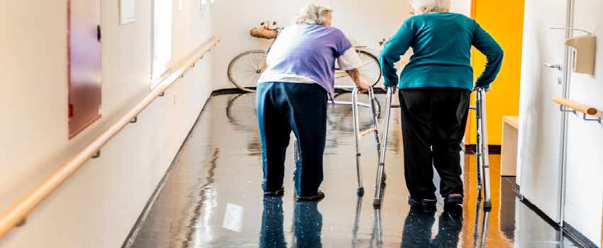 Seniors Walking In Nursing Home
